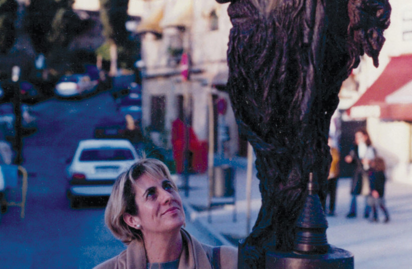  Rosa Hidalgo with the sculpture. (photo credit: ROSA HIDALGO)