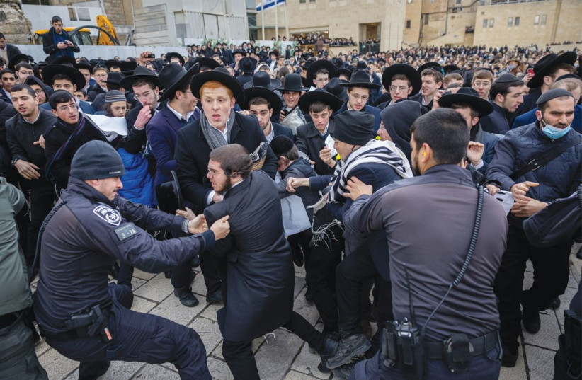 HAREDIM SCUFFLE with police at the Kotel, in protest of Women of the Wall’s Rosh Hodesh prayer service, March 4. (photo credit: YONATAN SINDEL/FLASH90)