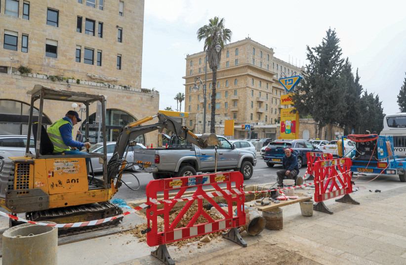  PEDESTRIANS GET to tackle an obstacle course as the sidewalks get a makeover (King David Hotel seen in  background R). (photo credit: MARC ISRAEL SELLEM)