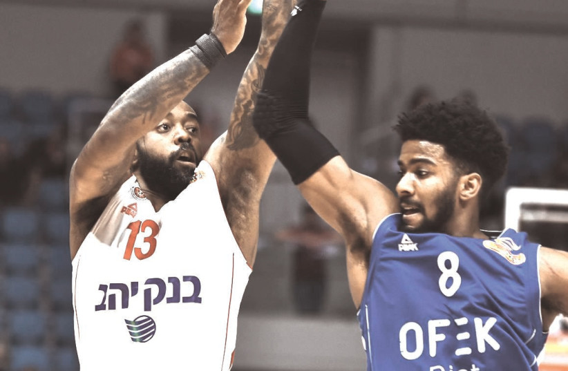 KC RIVERS (13) follows through on a shot in his Hapoel Jerusalem debut this week, in which he was key contributor in a 89-88 victory over Bnei Herzliya. (photo credit: DOV HALICKMAN PHOTOGRAPHY)