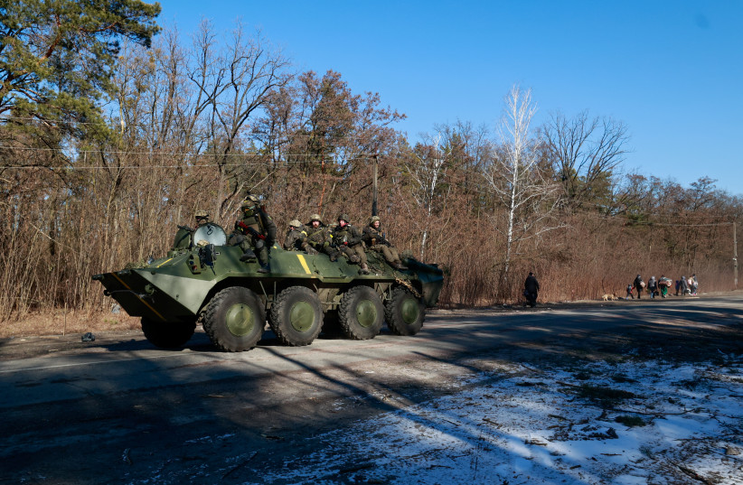  Members of the Ukrainian forces sit on a military vehicle amid Russia's invasion of Ukraine, in the Vyshgorod region near Kyiv, Ukraine March 10, 2022 (credit: REUTERS/SERHII NUZHNENKO)