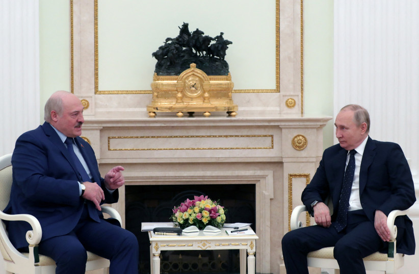  Russian President Vladimir Putin listens to Belarusian President Alexander Lukashenko during a meeting at the Kremlin in Moscow, Russia March 11, 2022. (credit: SPUTNIK/MIKHAIL KLIMENTYEV/KREMLIN VIA REUTERS)