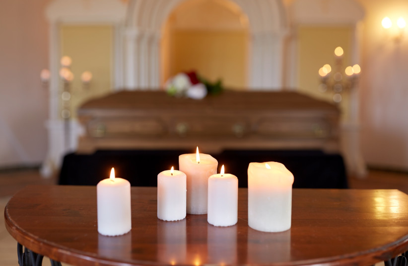  Burning candles at a coffin (photo credit: INGIMAGE)