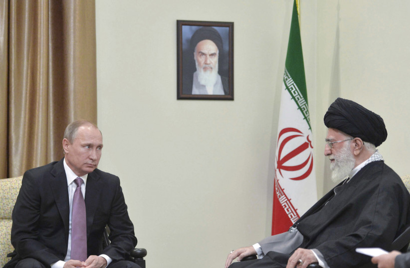  Russia's President Vladimir Putin (L), who arrived to attend the Gas Exporting Countries Forum (GECF), meets with Iran's Supreme Leader Ayatollah Ali Khamenei in Tehran, Iran, November 23, 2015.  (credit: ALEXEI DRUZHININ/SPUTNIK/KREMLIN/FILE PHOTO VIA REUTERS)