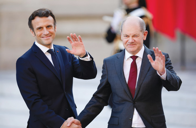  FRENCH PRESIDENT Emmanuel Macron welcomes German Chancellor Olaf Scholz to a summit of EU leaders at the Palace of Versailles on Thursday where Russia’s invasion of Ukraine was on the agenda. (photo credit: Sarah Meyssonnier/Reuters)