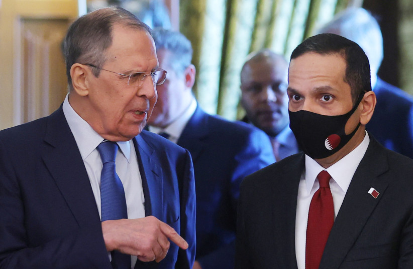  Russian Foreign Minister Sergei Lavrov and Qatari Deputy Prime Minister and Minister of Foreign Affairs Sheikh Mohammed bin Abdulrahman Al-Thani walk during their meeting in Moscow, Russia March 14, 2022. (photo credit: REUTERS/EVGENIA NOVOZHENINA)