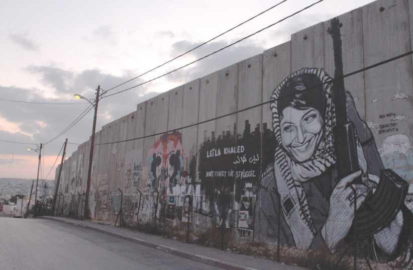  GRAFFITI ON the separation barrier in Bethlehem depicting Leila Khaled of the Popular Front for the Liberation of Palestine. (photo credit: Alana Perino/Flash90)
