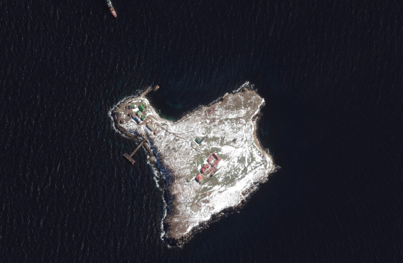  A satellite image shows an overview of Snake Island and Russian Ropucha ship, March 13, 2022.  (photo credit: Satellite image ©2022 Maxar Technologies/Handout via REUTERS)