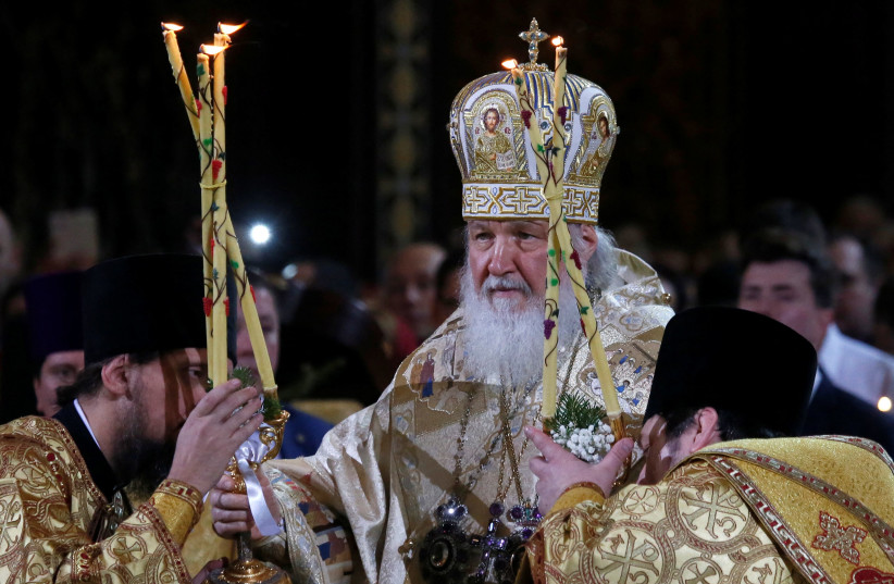   Patriarch Kirill, the head of the Russian Orthodox Church, conducts a service on Orthodox Christmas at the Christ the Saviour Cathedral in Moscow, Russia January 6, 2018. (photo credit: MAXIM SHEMETOV/REUTERS)