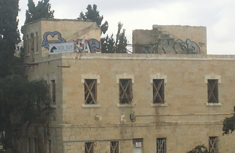  ANTIFACIST ACTION graffiti in Jerusalem – symbolized by the AFA, flag indicating Communism, and black and red colors – expressing anarcho-Communist sentiments. (credit: MICHAEL STARR)