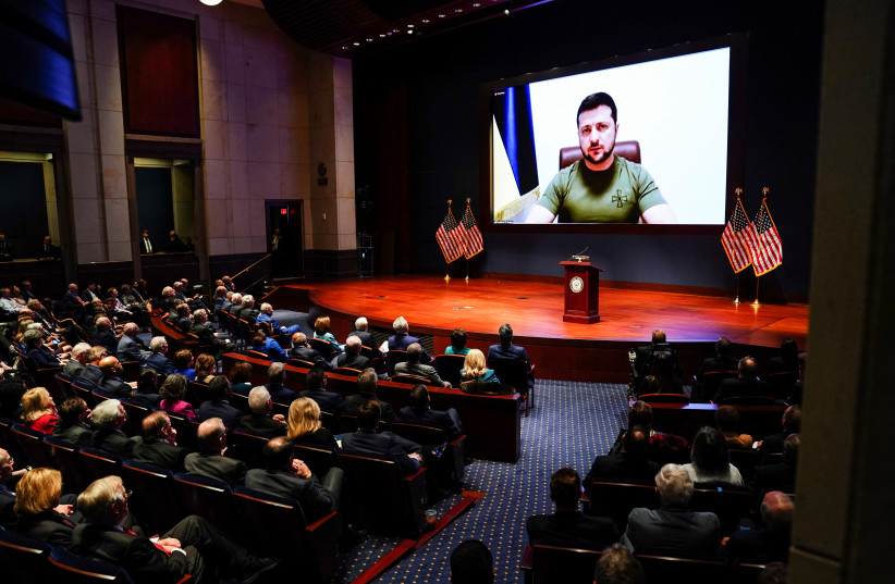  Ukraine’s President Volodymyr Zelenskiy delivers a video address to senators and members of the House of Representatives gathered in the Capitol Visitor Center Congressional Auditorium at the US Capitol in Washington, US, March 16, 2022. (photo credit: REUTERS/SARAH SILBIGER)