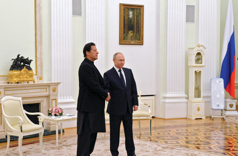  RUSSIAN PRESIDENT Vladimir Putin shakes hands with Pakistan’s Prime Minister Imran Khan during a meeting in Moscow on February 24, the day Russia invaded Ukraine. (photo credit: Sputnik/Kremlin/Reuters)