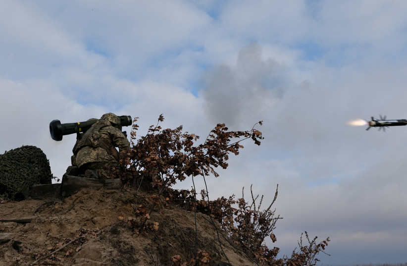 Service members of the Ukrainian Armed Forces fire a Javelin anti-tank missile during drills at a training ground in an unknown location in Ukraine, in this handout picture released February 18, 2022. (credit: UKRAINIAN JOINT FORCES OPERATION PRESS SERVICE/HANDOUT VIA REUTERS)