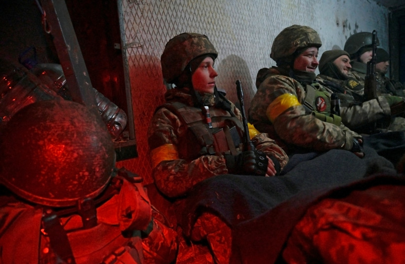 Ukrainian servicemen take cover in a shelter at fighting positions at the military airbase Vasylkiv in the Kyiv region, Ukraine, February 26, 2022. (credit: REUTERS/MAKSIM LEVIN)