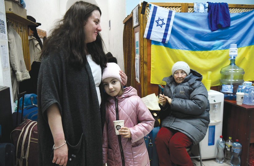  UKRAINIAN JEWS fleeing from the Russian invasion wait to receive their entry papers to Israel, at an emergency shelter in Moldova last week (credit: YOSSI ZLIGER)