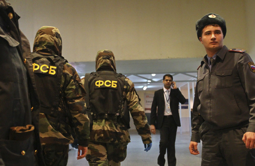  Law enforcement officers guard the entrance to Domodedovo airport as part of increased security measures following the deadly blast, January 2011 (photo credit: RIA Novosti/Wikimedia Commons)