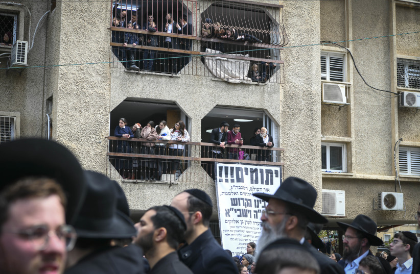  Ultra-Orthodox Jews gather during the funeral ceremony of Rabbi Chaim Kanievsky in the streets near the cemetery  in the city of Bnei Brak, on March 20, 2022 (credit: TOMER NEUBERG/FLASH90)