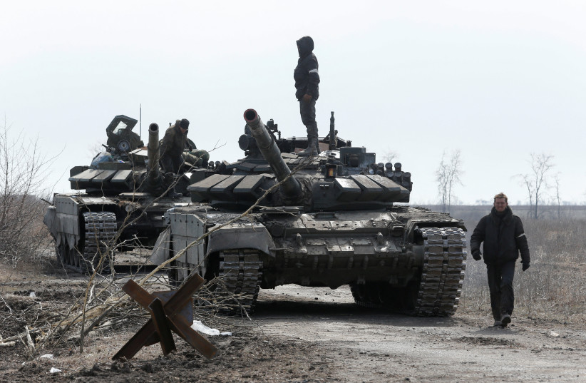  A view shows service members of pro-Russian troops and tanks during Ukraine-Russia conflict on the outskirts of the besieged southern port city of Mariupol, Ukraine March 20, 2022 (photo credit: REUTERS/ALEXANDER ERMOCHENKO)