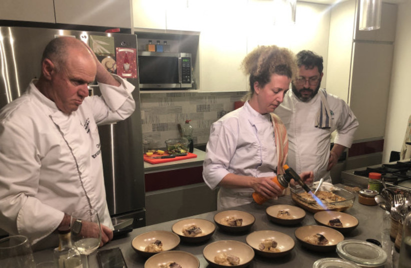  Chefs for Peace working in the kitchen together (photo credit: CARRIE HART / ALL ISRAEL NEWS)