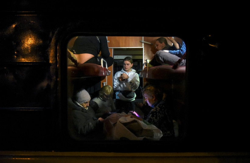  Civilians fleeing Russia's invasion of Ukraine are seen onboard an evacuation train, in Odesa, Ukraine, March 16, 2022. Picture taken March 16, 2022.  (photo credit:  REUTERS/ALEXANDROS AVRAMIDIS)