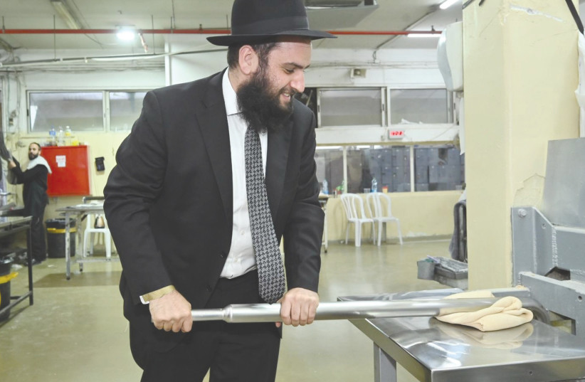  UAE RABBI Levi Duchman, baking matzot at Kfar Chabad.  (credit: SHNEOR SARIF)