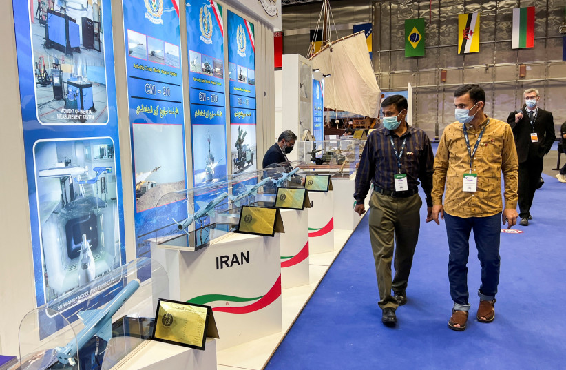  Visitors look at Anti-ship Cruise Missile Weapon System models at the IRGC booth at the Doha International Maritime Defense Exhibition and Conference (DIMDEX) in Doha (photo credit: REUTERS)