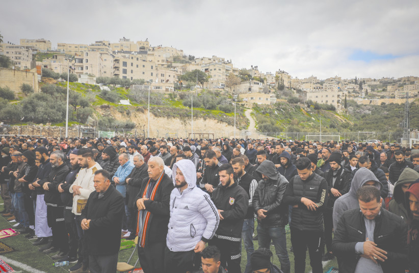  PALESTINIANS WORSHIP at Friday prayers, as they protest the demolition of homes by Israeli authorities at the east Jerusalem neighborhood of Jabel Mukaber earlier this month. (photo credit: JAMAL AWAD/FLASH90)