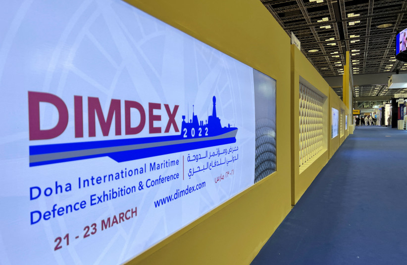  A screen reading DIMDEX 2022 is pictured at the Doha International Maritime Defense Exhibition and Conference (DIMDEX) in Doha, Qatar March 22, 2022 (photo credit: REUTERS/IMAD CREIDI)