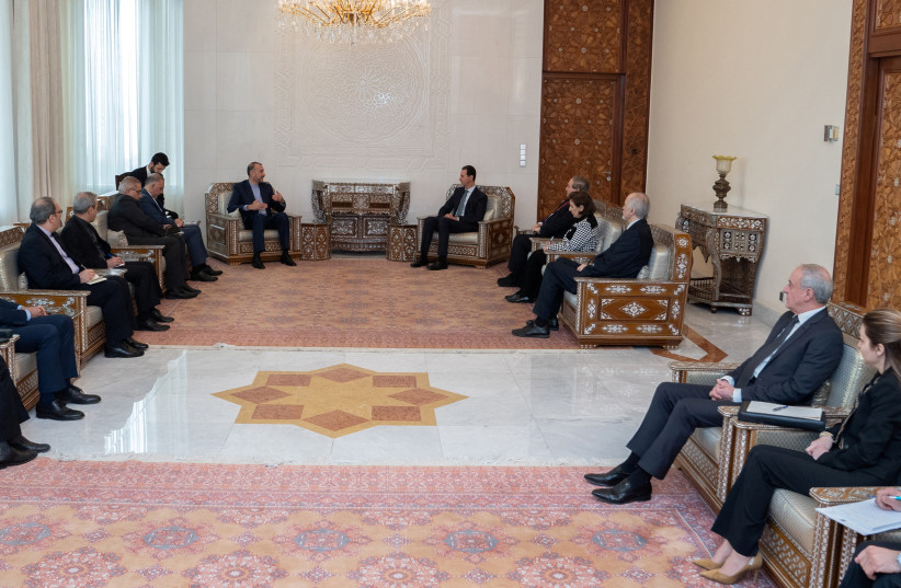  Iranian Foreign Minister Hossein Amir-Abdollahian meets with Syria's President Bashar al-Assad in Damascus, Syria, in this handout released by SANA on March 23, 2022.  (credit: SANA/HANDOUT VIA REUTERS)