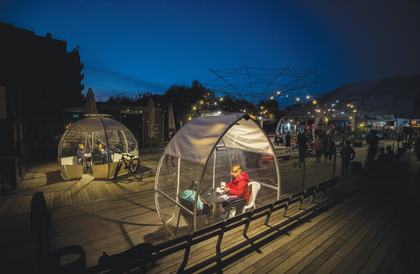  ENJOYING OUTDOOR ‘bubble’ dining at the First Station: ‘How could [Mayor Lion] think of destroying this wonderfully successful place by building towers all around it?’  (credit: YONATAN SINDEL/FLASH90)