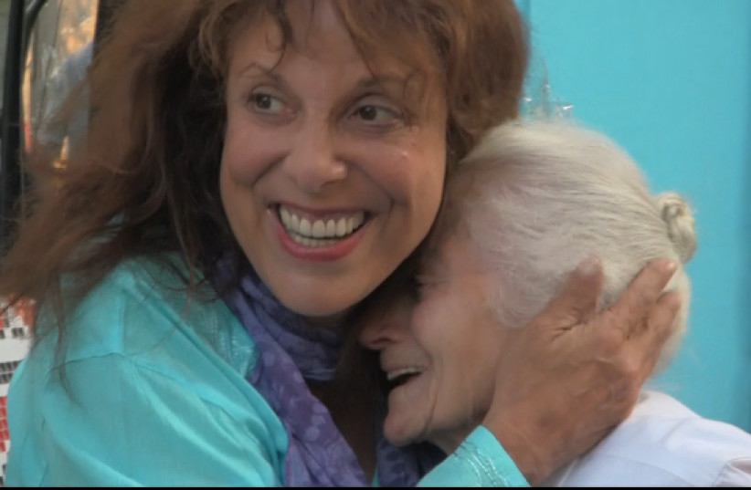  SMP FOUNDER Zane Buzby hugs survivor Anna Israelevna. (photo credit: ©The Survivor Mitzvah Project Holocaust Educational Archive)