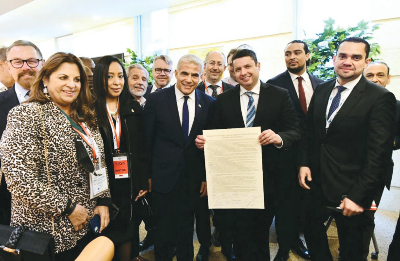  20 FOREIGN PARLIAMENTARIANS, in Israel as members of the Israel Allies Foundation, present Foreign Minister Yair Lapid with a resolution confirming their support for the Jewish state and the IHRA working definition of antisemitism. (credit: AVI HAYOUN)
