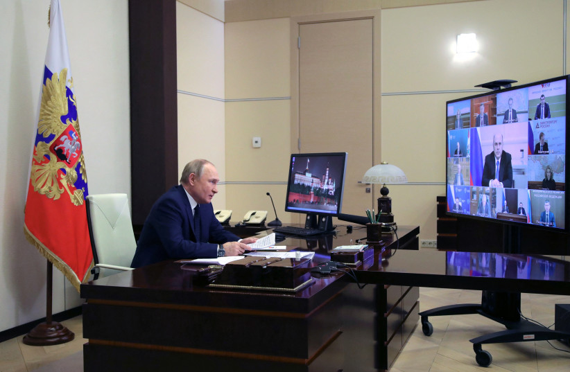  Russian President Vladimir Putin attends a meeting with government members via a video link at the Novo-Ogaryovo state residence outside Moscow, Russia, March 23, 2022. (credit: SPUTNIK/MIKHAIL KLIMENTYEV/KREMLIN VIA REUTERS)