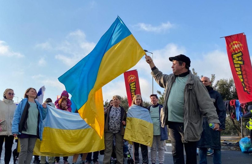  Ukrainian flags wave at the 11th Annual Jerusalem Marathon, March 25, 2022.  (credit: MARATHON PHOTO GALLERY 2022)
