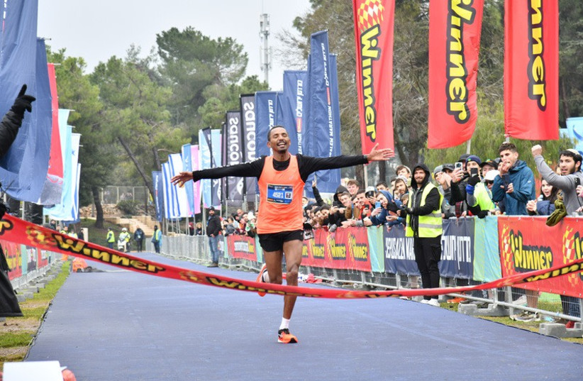  Agadi Guadi, 33, from Israel, wins the full marathon race at the Jerusalem Marathon at 2:37:17, March 25, 2022.  (credit: Sportphotography)