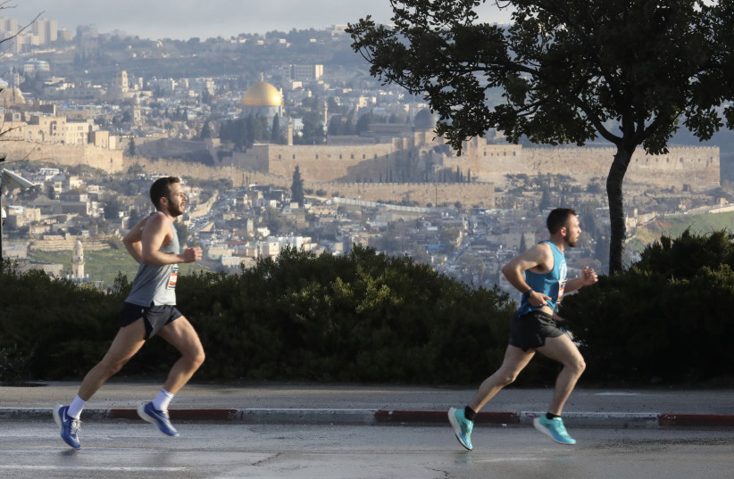   Runners at the Jerusalem Marathon 2022, March 25, 2022.  (photo credit: MARC ISRAEL SELLEM/THE JERUSALEM POST)