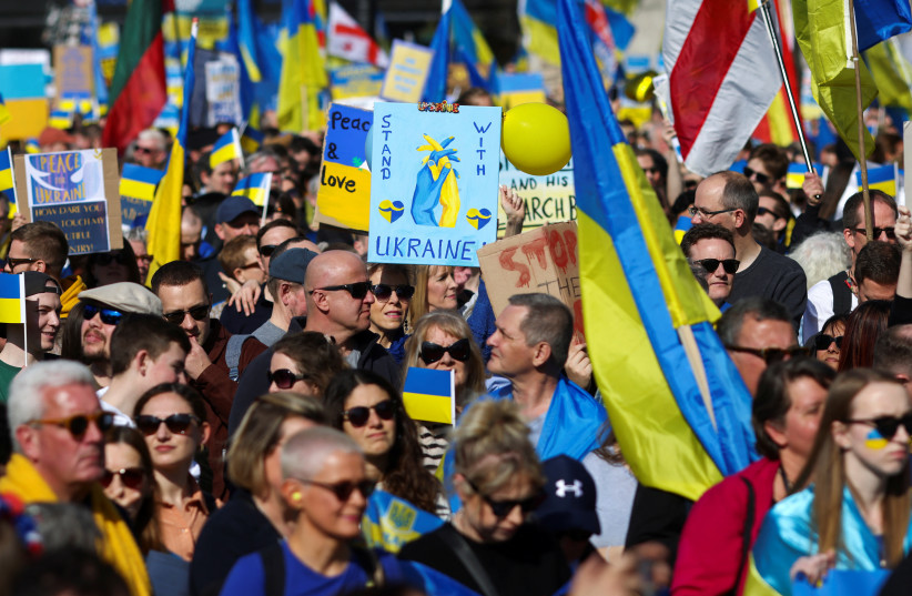  People attend a demonstration in support of Ukraine, amid Russia's invasion of Ukraine, in central London, Britain March 26, 2022. (credit: REUTERS/TOM NICHOLSON)