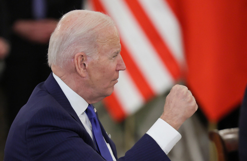  US President Joe Biden attends a bilateral meeting with the Polish Delegation (not pictured), amid Russia's invasion of Ukraine, in the Column Hall at the Presidential Palace, in Warsaw, Poland March 26, 2022. (credit: REUTERS/EVELYN HOCKSTEIN)