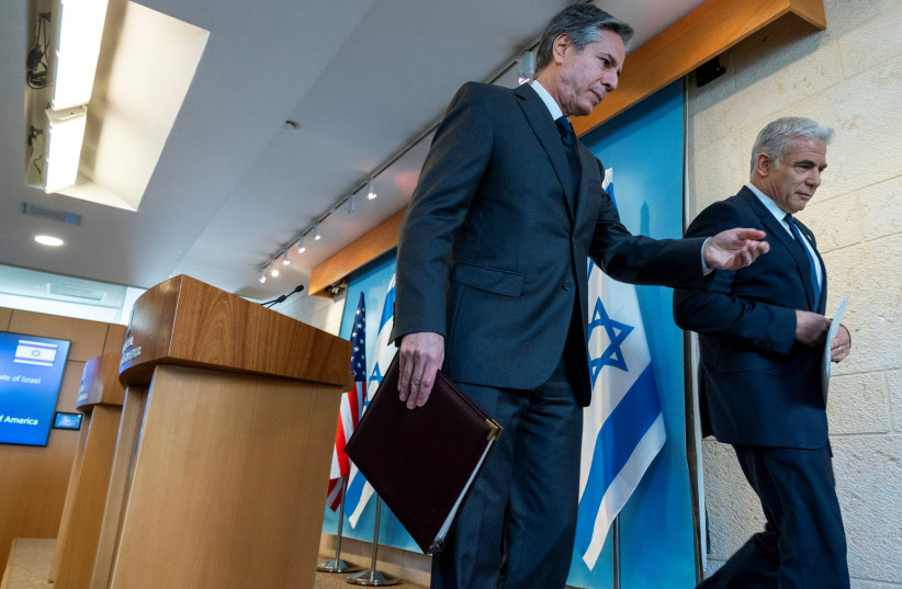  US Secretary of State Antony Blinken and Israel's Foreign Minister Yair Lapid leave after a news conference at Israel's Ministry of Foreign Affairs in Jerusalem, March 27, 2022. (credit: Jacquelyn Martin/Pool via REUTERS)