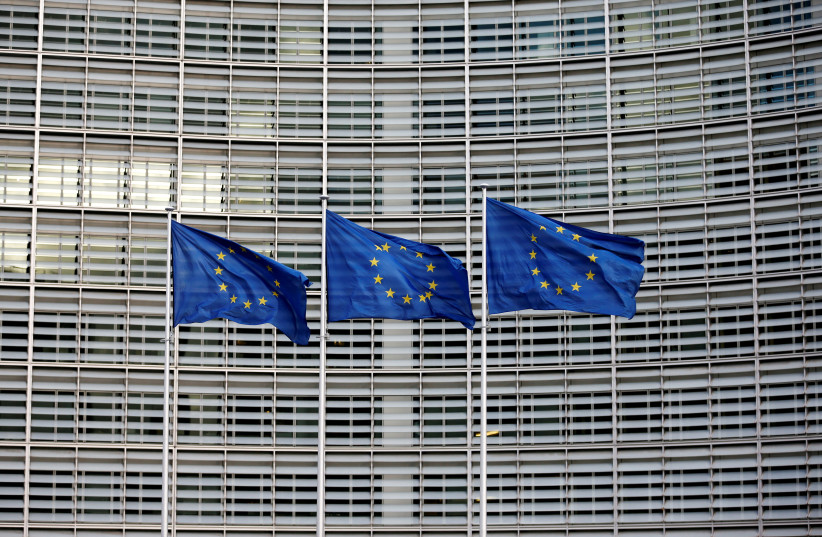 European Union flags flutter outside the EU Commission headquarters in Brussels, Belgium, January 18, 2018. (credit: REUTERS/FRANCOIS LENOIR/FILE PHOTO)