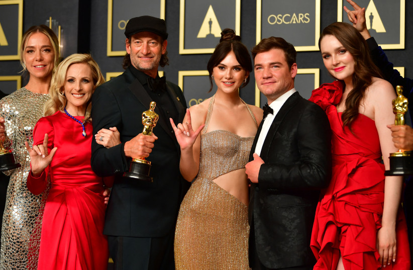  The cast of CODA hold their award for Best Picture in the press room during the 94th Oscars at the Dolby Theatre in Hollywood, March 27, 2022. (photo credit: Frederic J. Brown/AFP via Getty Images)