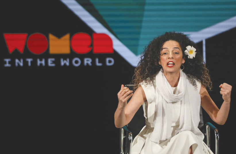  IRANIAN JOURNALIST and women’s rights activist Masih Alinejad speaks on stage at the Women in the World Summit in New York, in 2019. (photo credit: BRENDAN MCDERMID/REUTERS)