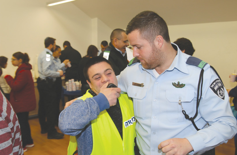  POLICE OFFICERS participate in an Akim-Jerusalem Hanukkah party. (photo credit: ISRAEL POLICE SPOKESPERSON'S UNIT)