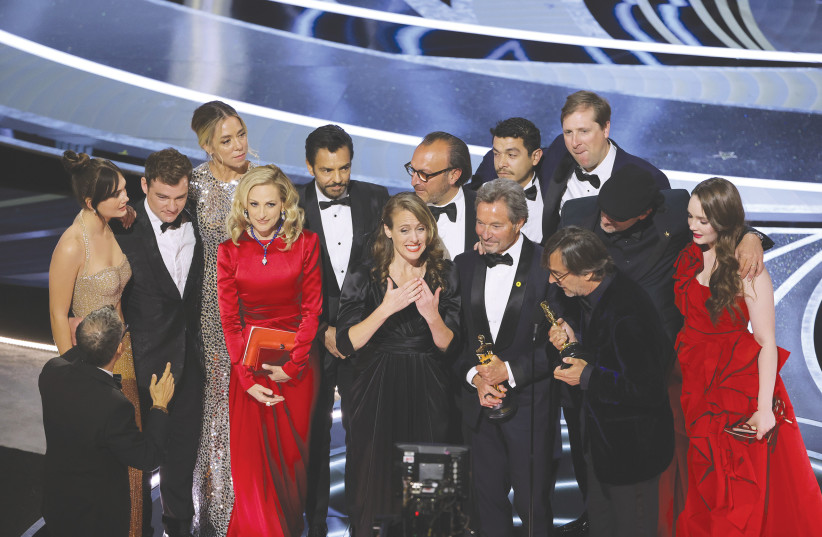  THE CAST of ‘CODA’ accept the Academy Award for  Best Picture. (credit: Neilson Barnard/Getty Images/TNS)