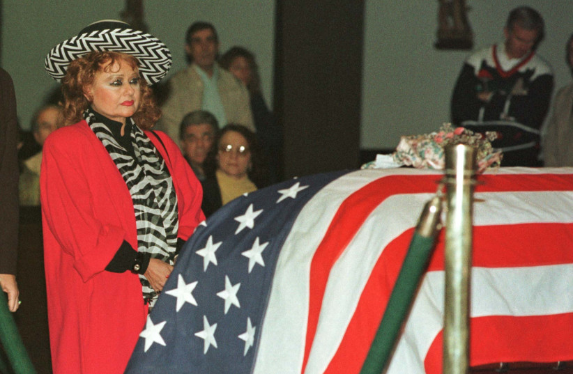  Tammy Faye Bakker, ex-wife of television evangelist Jim Bakker, stands at the flag draped coffin of former Palm Springs mayor and Congressman Sonny Bono in 1998. (photo credit: REUTERS PHOTOGRAPHER)