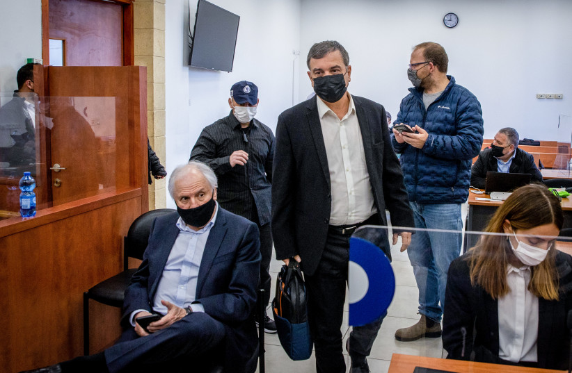 Shlomo Filber, former director general of the Communications Ministry and Israeli businessman, Shaul Elovitch seen during a court hearing in the trial against former Israeli prime minister Benjamin Netanyahu, at the District Court in Jerusalem on March 29, 2022. (credit: OREN BEN HAKOON/POOL)
