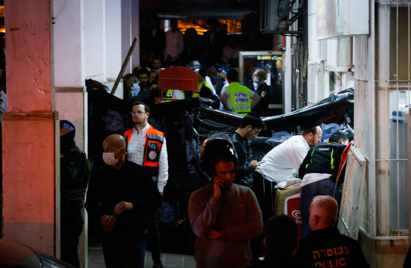 Israel Police officers and rescue forces are seen at the scene of a shooting attack in Bnei Brak, March 29, 2022 (photo credit: OLIVIER FITOUSSI/FLASH90)