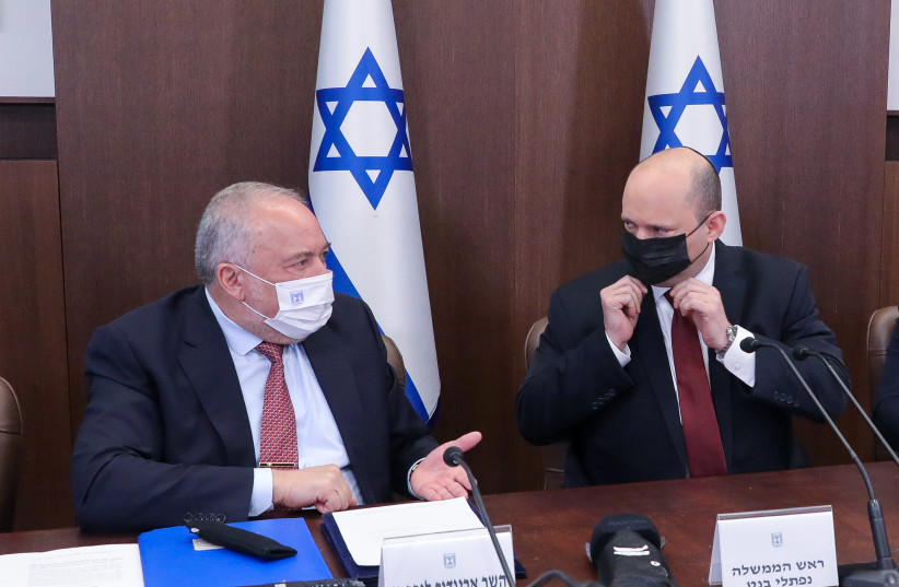  Finance Minister Avigdor Liberman chats with Prime Minister Naftali Bennett at the weekly cabinet meeting in Jerusalem on March 20. (credit: MARC ISRAEL SELLEM)