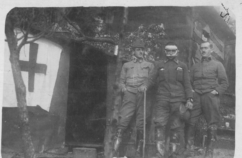  Dr. Barasch, his orderly, and a wounded ensign in front of the medical center in Makuci, December 1916 (credit: SHULA KOPF)