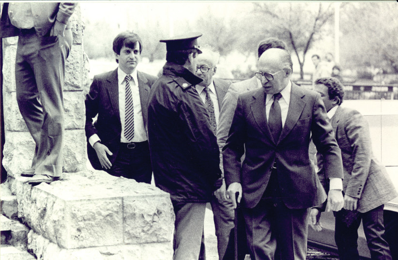  THEN-CABINET SECRETARY Dan Meridor (L) accompanies Prime Minister Menachem Begin before his testimony to the inquiry commission on the Sabra and Shatila massacres, Jerusalem, 1982.  (photo credit: JERUSALEM POST ARCHIVE)